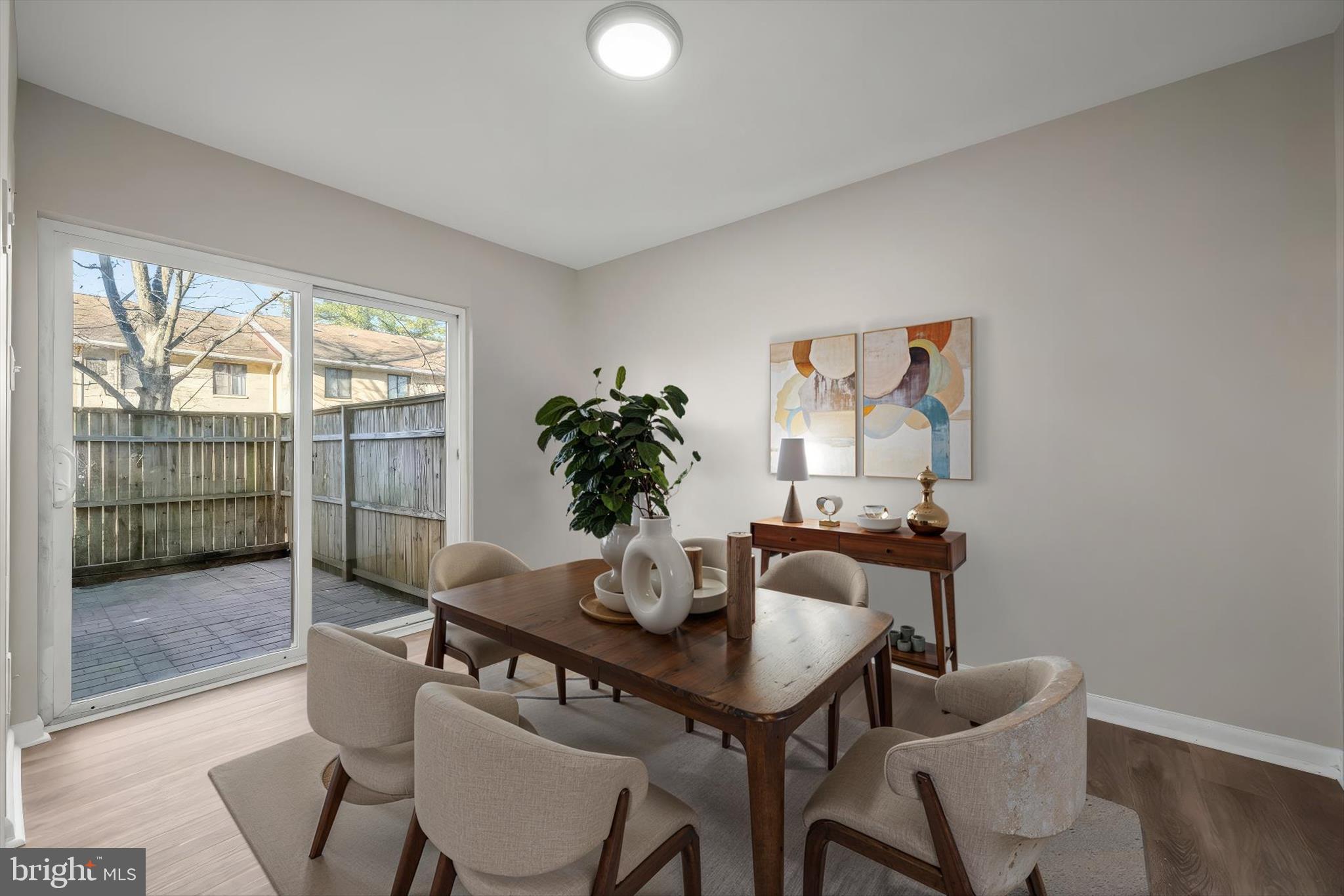 8869 Tamebird Court, Unit D T22 Columbia, MD 21045 - Photo 4 of 39 Dining room w/ patio access (virtually staged)