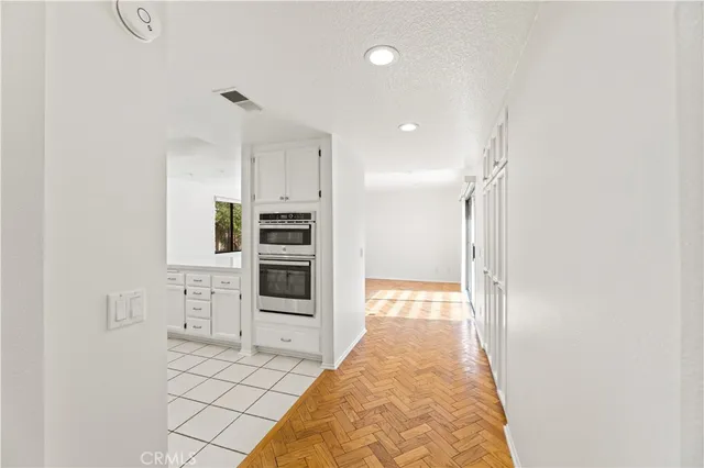 a kitchen with granite countertop cabinets stainless steel appliances and a sink