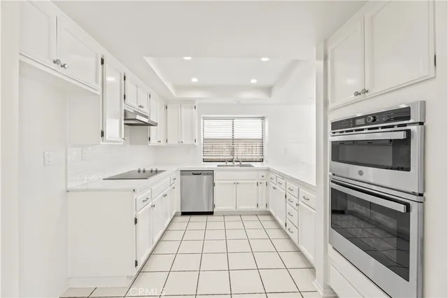 a view of cabinets with wooden floor