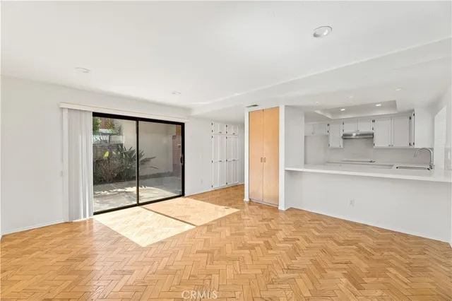 a bathroom with a granite countertop toilet and a sink