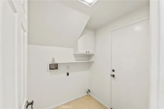 a view of water heater room with window