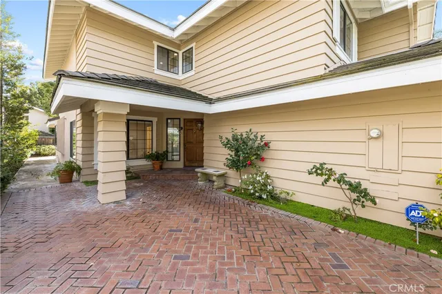 a view of a chair and table in the back yard