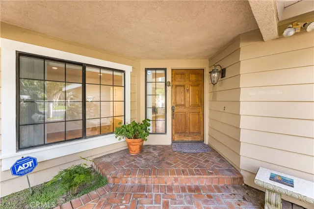 a view of an entryway with garden