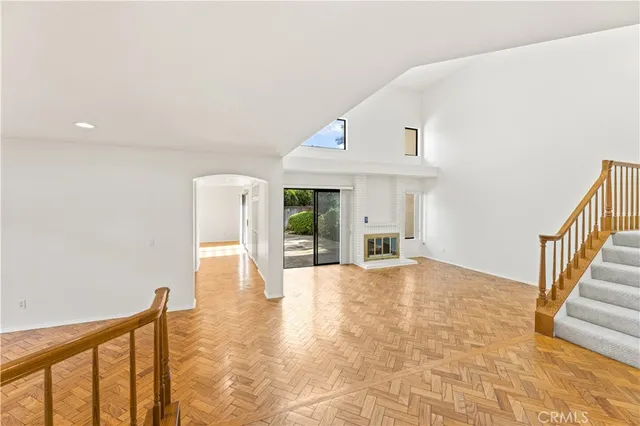 a view of an entryway with wooden floor