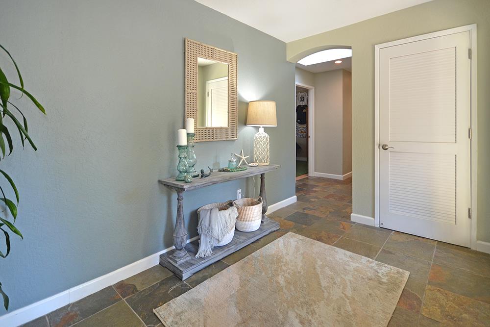 114 Solano Avenue La Selva Beach, CA 95076 - Photo 13 of 38 wooden floor with a mirror and a sink