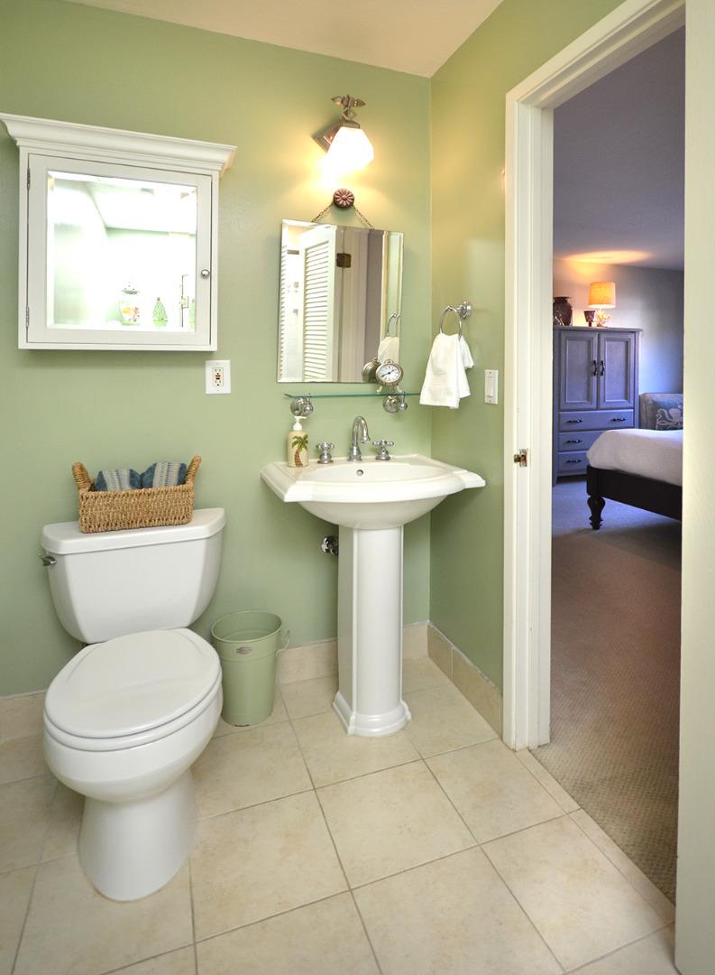 114 Solano Avenue La Selva Beach, CA 95076 - Photo 17 of 38 a bathroom with a toilet sink and mirror