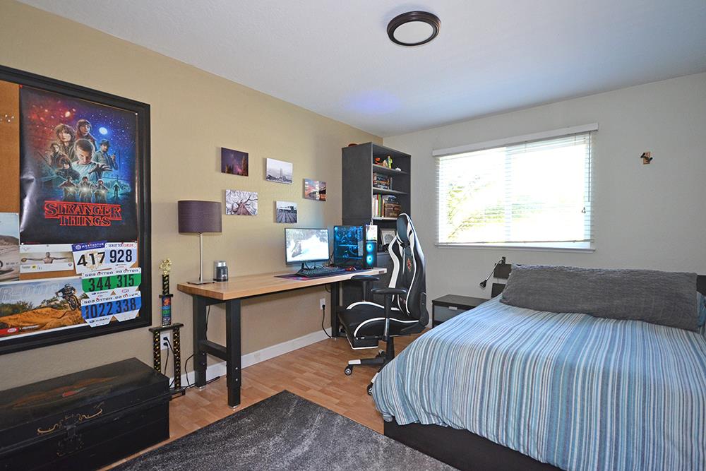 114 Solano Avenue La Selva Beach, CA 95076 - Photo 19 of 38 a bedroom with a bed and a desk