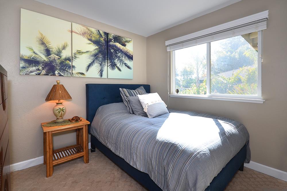 114 Solano Avenue La Selva Beach, CA 95076 - Photo 20 of 38 a bedroom with a bed and a window
