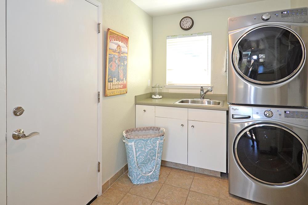 114 Solano Avenue La Selva Beach, CA 95076 - Photo 24 of 38 a utility room with sink dryer and washer