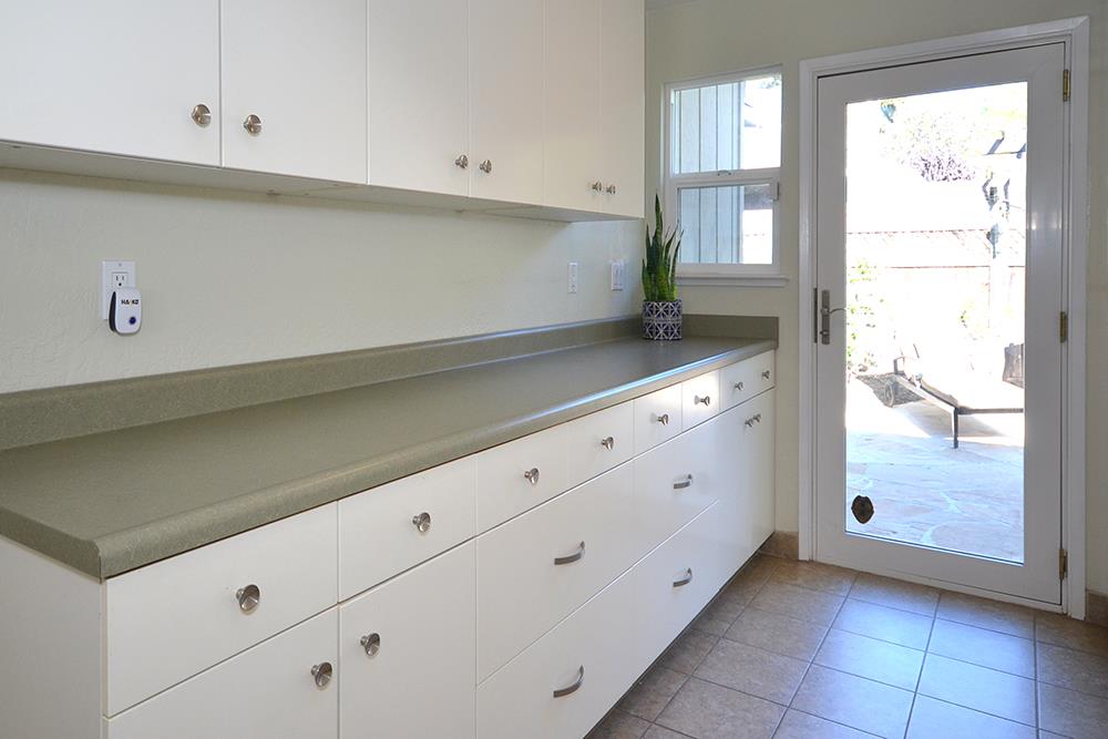 114 Solano Avenue La Selva Beach, CA 95076 - Photo 25 of 38 a kitchen with granite countertop white cabinets and a sink