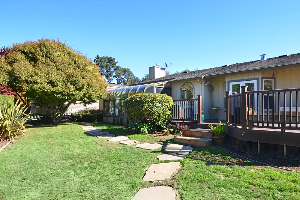 114 Solano Avenue La Selva Beach, CA 95076 - Photo 30 of 38 a backyard of a house with a garden and fire pit
