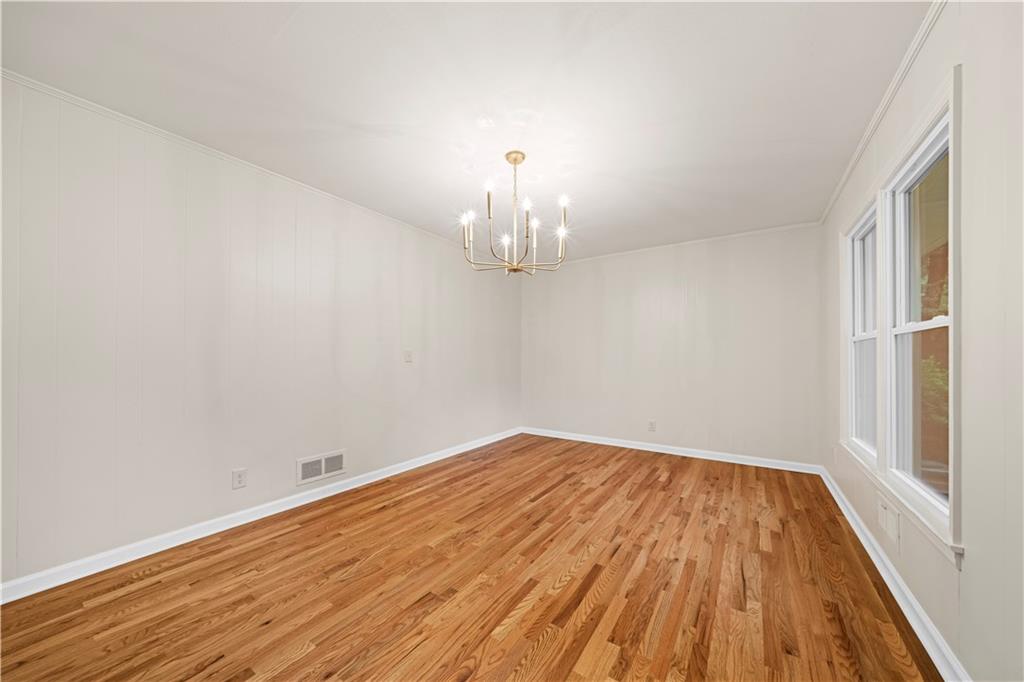 23 East Camelia Road Northeast Rome, GA 30161 - Photo 11 of 27 a view of a room with wooden floor chandelier and a window