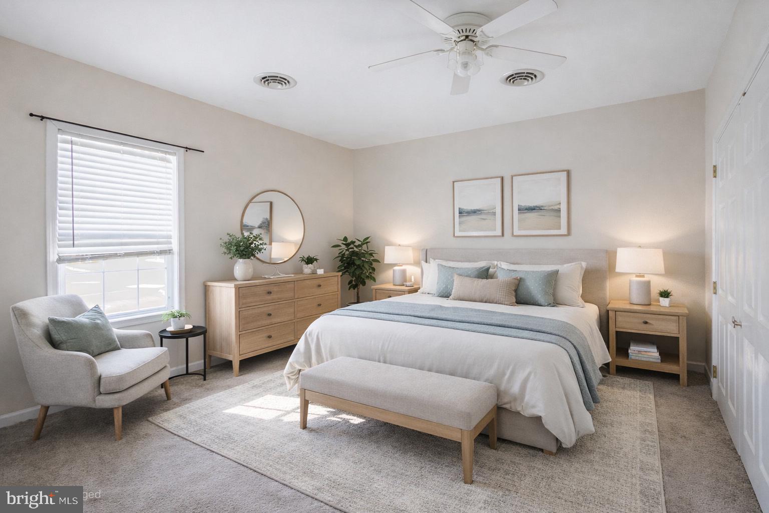 8186 June Way, Unit 601 Easton, MD 21601 - Photo 22 of 30 a spacious bedroom with a bed a couch and dresser
