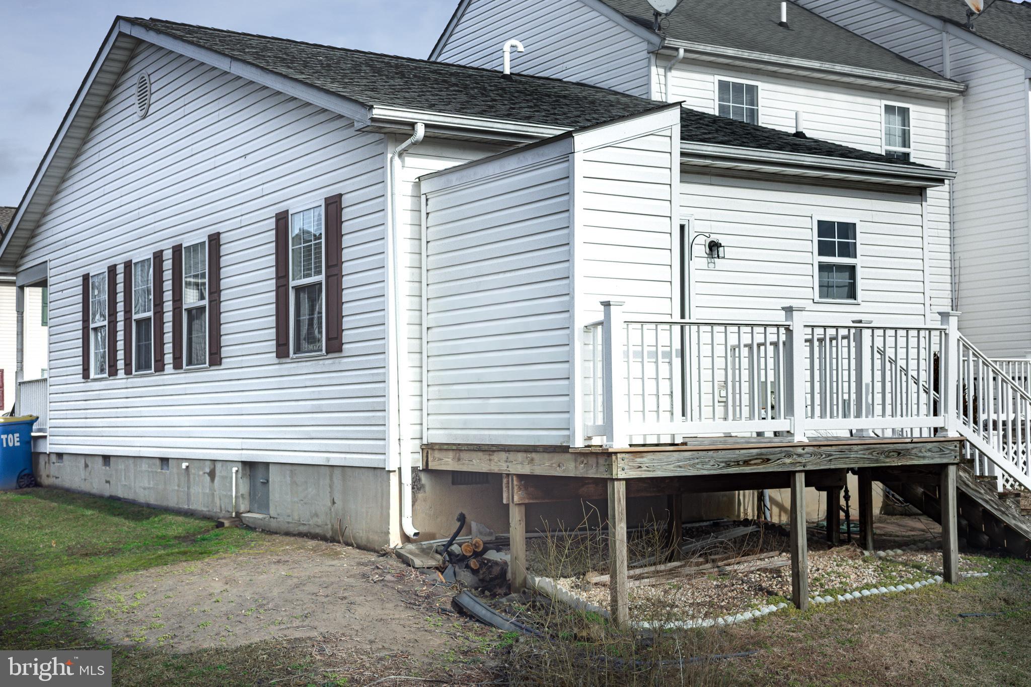 8186 June Way, Unit 601 Easton, MD 21601 - Photo 3 of 30 a backyard of a house with table and chairs