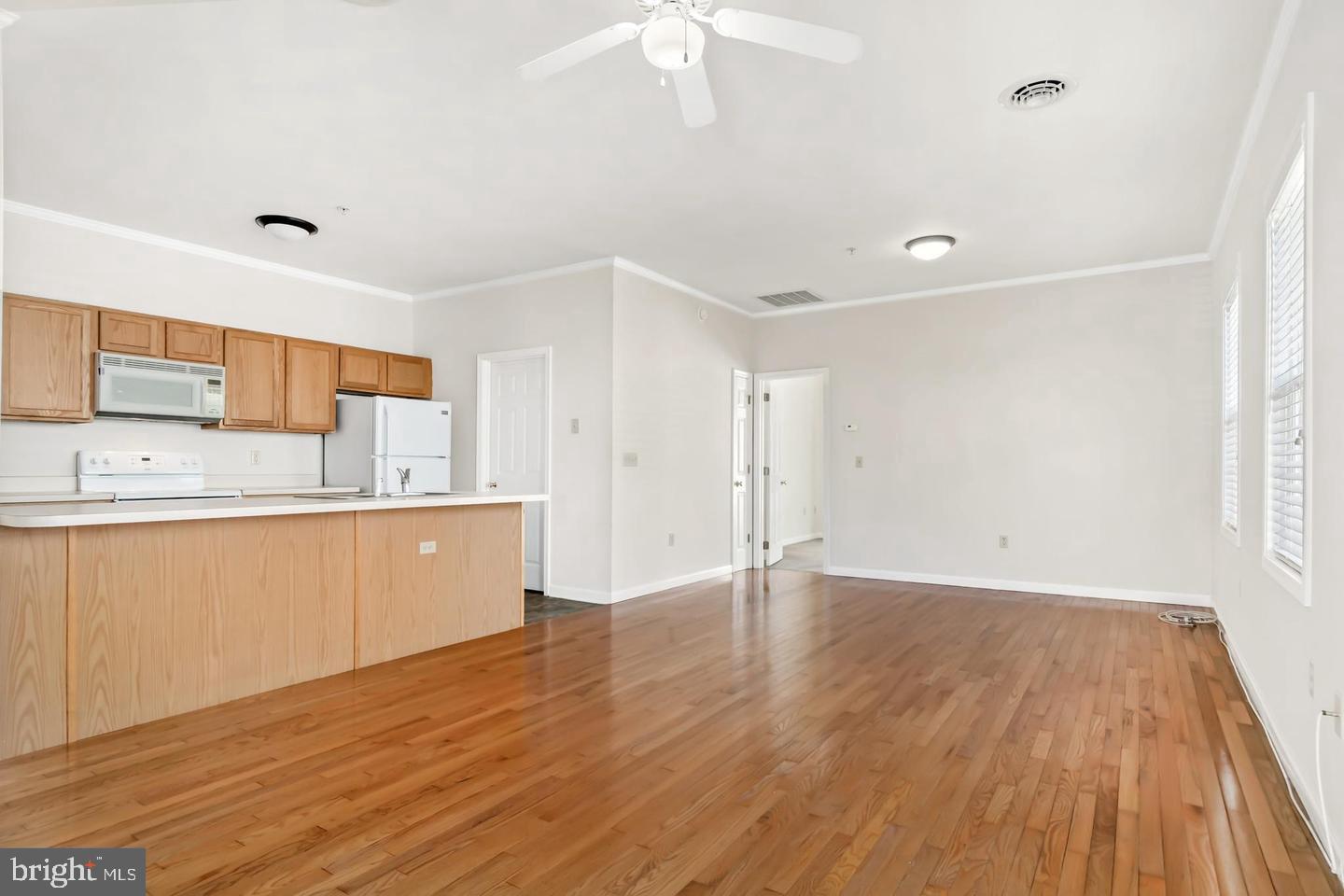 8186 June Way, Unit 601 Easton, MD 21601 - Photo 30 of 30 a view of kitchen with wooden floor and electronic appliances
