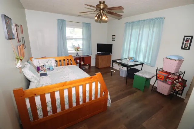 a bedroom with furniture and a window