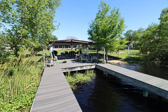 a view of a swimming pool with sitting area