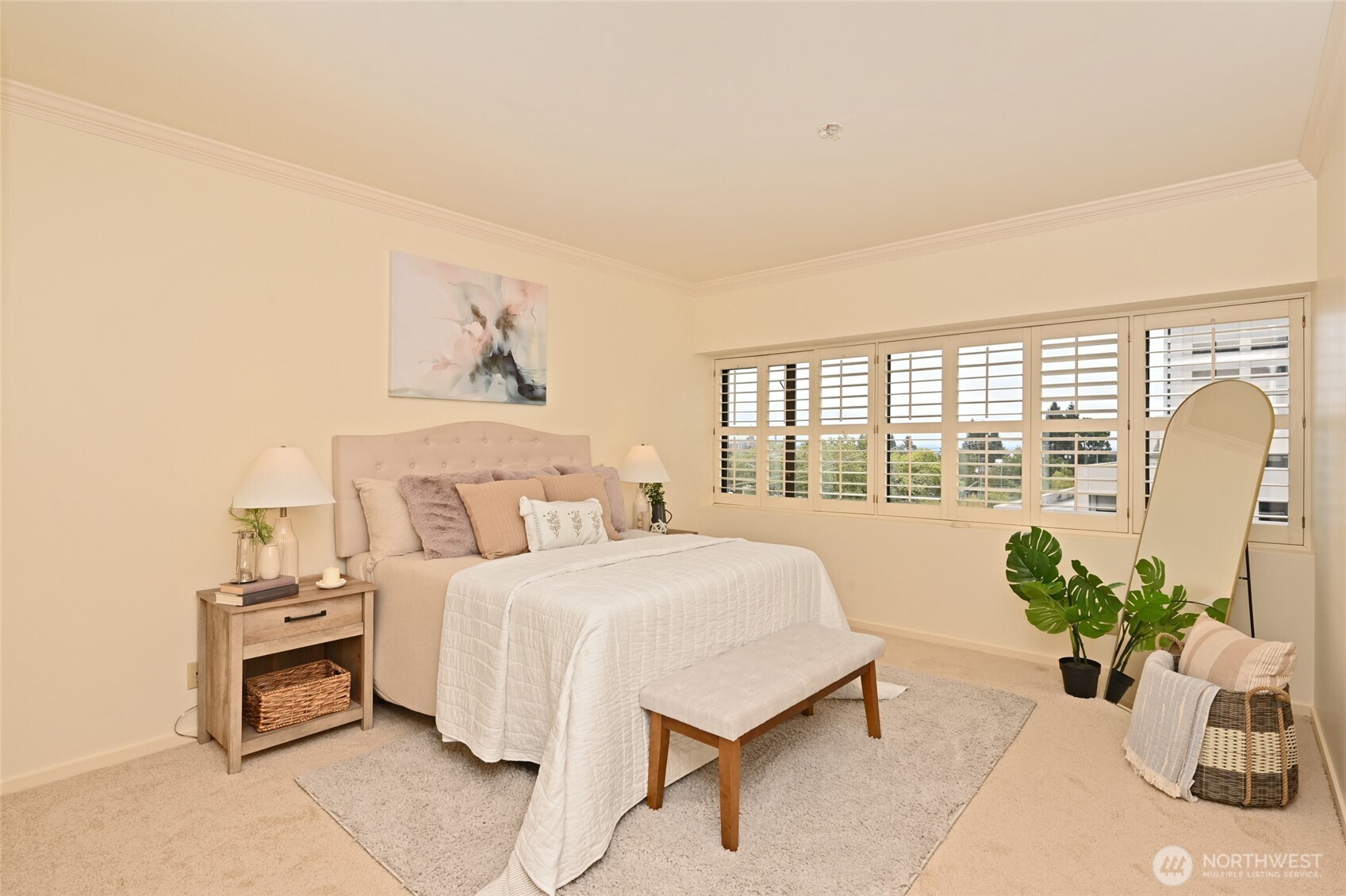 1301 Spring Street, Unit 6D Seattle, WA 98104 - Photo 12 of 29 a bedroom with a bed and a potted plant