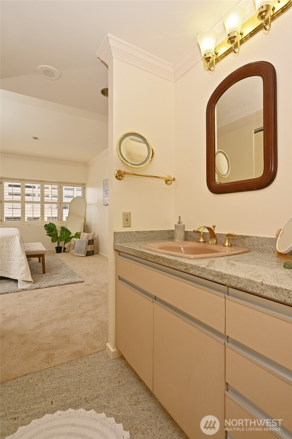 1301 Spring Street, Unit 6D Seattle, WA 98104 - Photo 14 of 29 a en suite bathroom with a granite countertop sink and a mirror