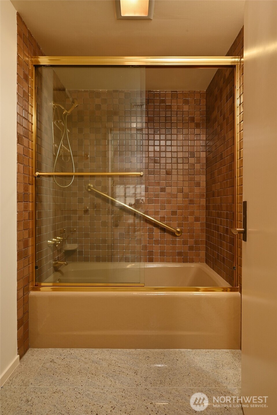 1301 Spring Street, Unit 6D Seattle, WA 98104 - Photo 16 of 29 a bathroom with a shower and bathtub