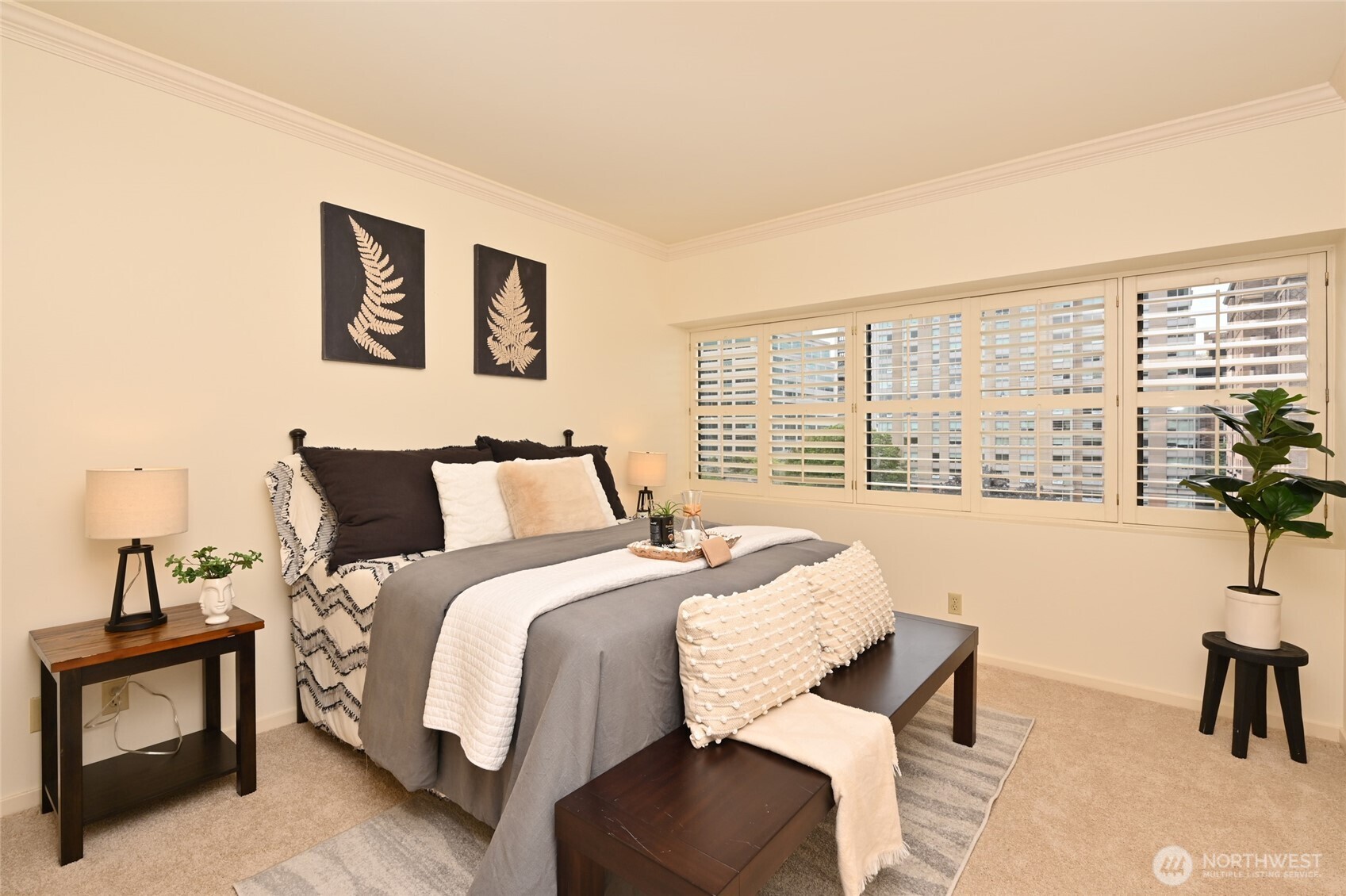 1301 Spring Street, Unit 6D Seattle, WA 98104 - Photo 18 of 29 a bed room with a bed and a chair