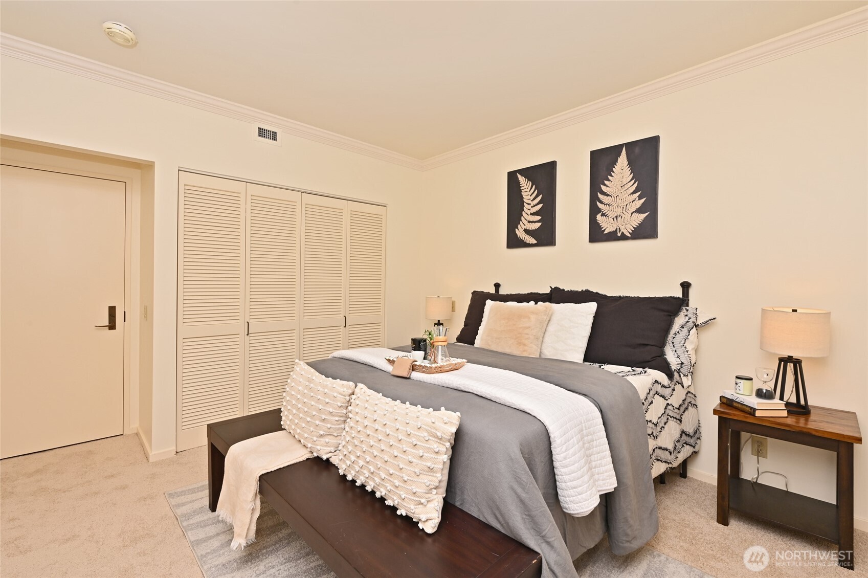 1301 Spring Street, Unit 6D Seattle, WA 98104 - Photo 19 of 29 a bedroom with a bed and wooden floor