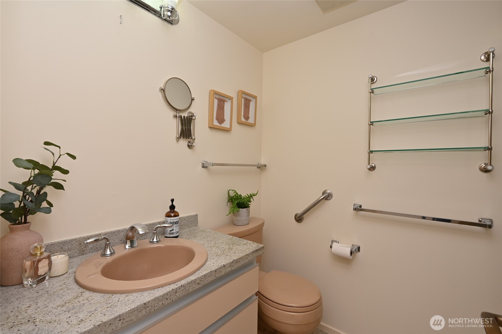1301 Spring Street, Unit 6D Seattle, WA 98104 - Photo 20 of 29 a bathroom with a granite countertop sink and a mirror