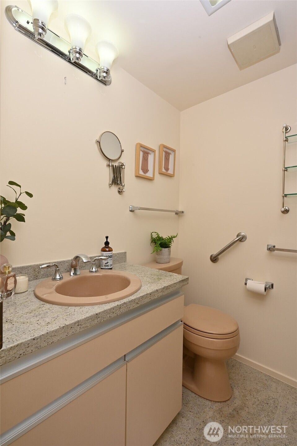 1301 Spring Street, Unit 6D Seattle, WA 98104 - Photo 21 of 29 a bathroom with a granite countertop sink mirror and toilet