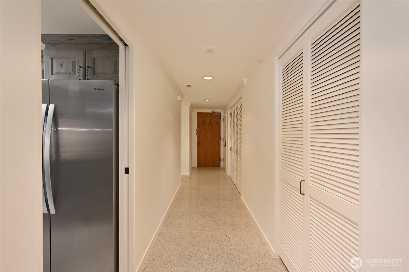1301 Spring Street, Unit 6D Seattle, WA 98104 - Photo 24 of 29 a view of a hallway with wooden floor