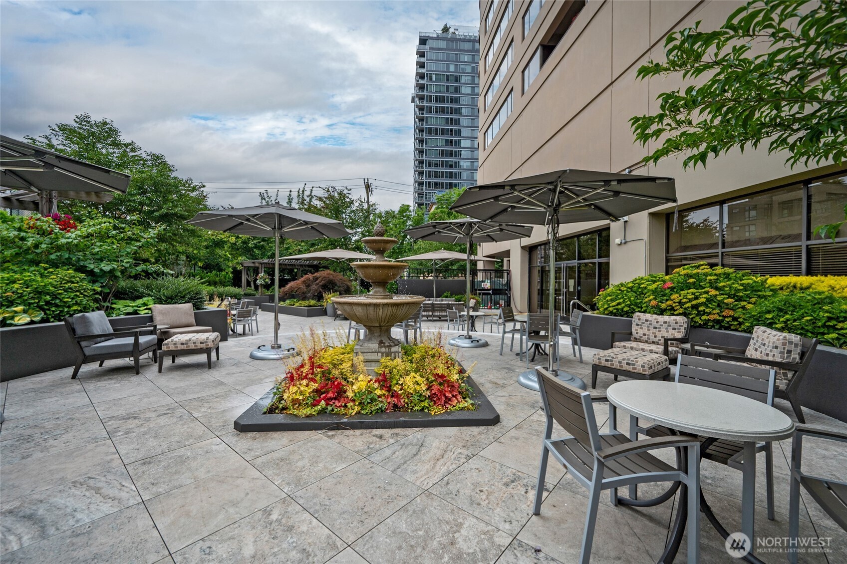 1301 Spring Street, Unit 6D Seattle, WA 98104 - Photo 25 of 29 a view of outdoor sitting area with furniture and wooden fence