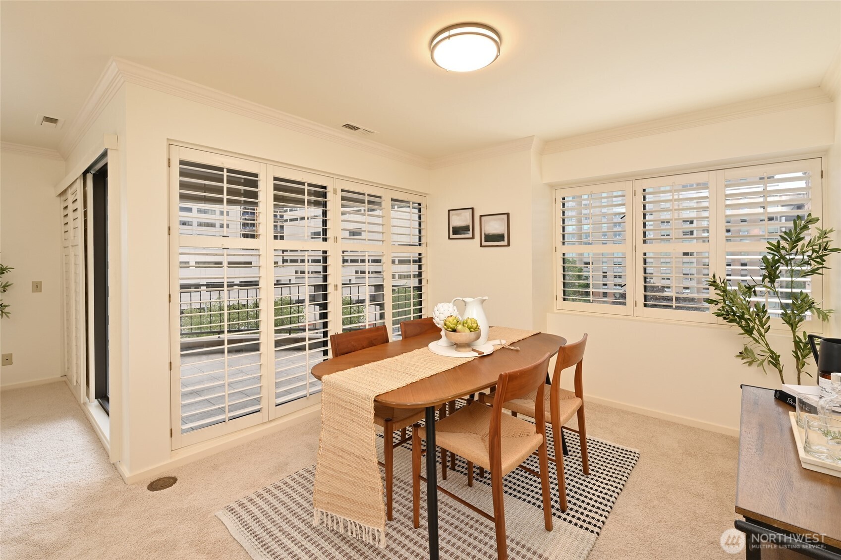 1301 Spring Street, Unit 6D Seattle, WA 98104 - Photo 5 of 29 a view of a dining room with furniture window and outside view