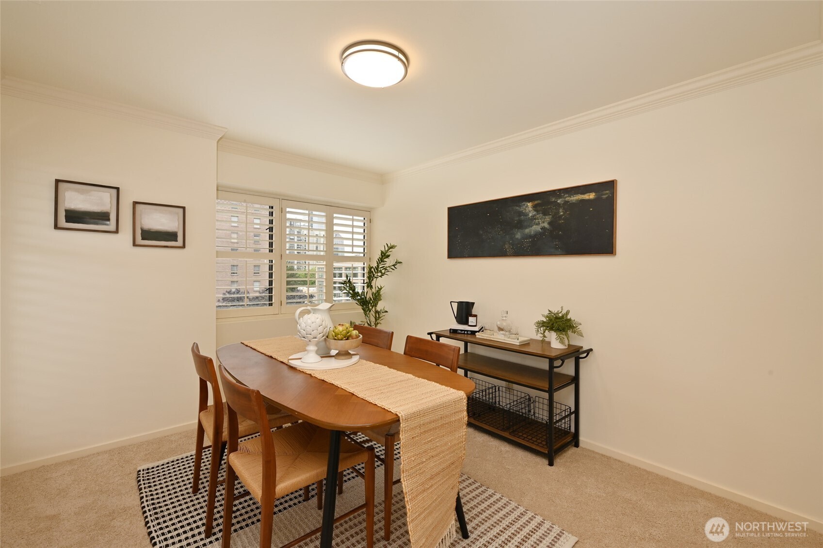 1301 Spring Street, Unit 6D Seattle, WA 98104 - Photo 6 of 29 a living room with furniture and a flat screen tv