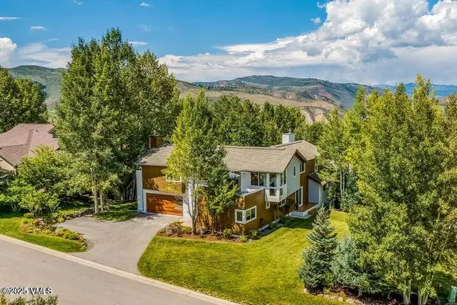 an aerial view of a house with a garden