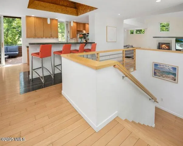 a view of kitchen with furniture and electronic appliances