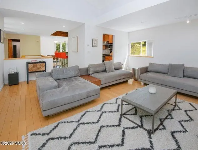 a living room with furniture and a table