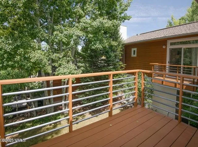 a view of outdoor space with wooden deck and furniture