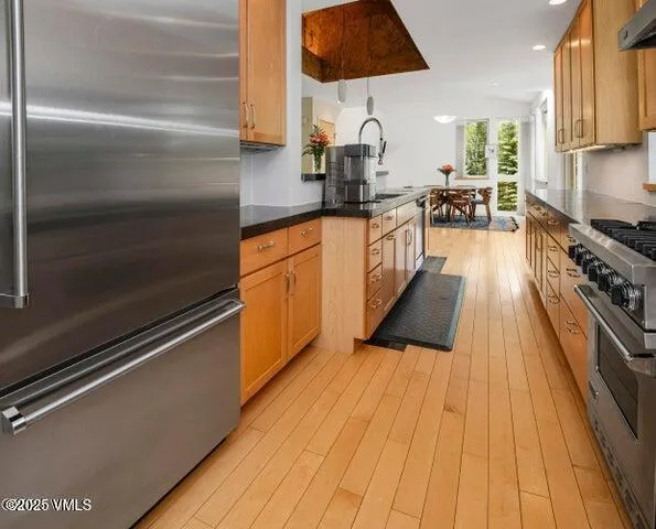 a kitchen with sink and cabinets