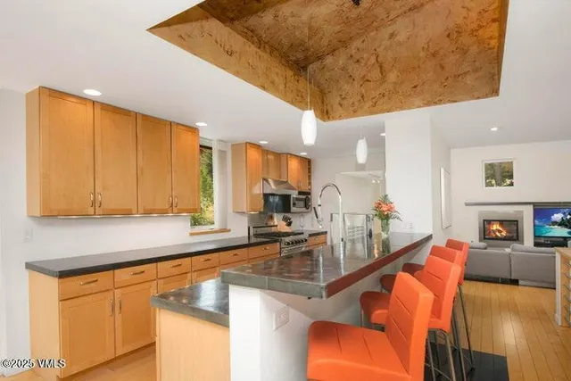a kitchen with stainless steel appliances granite countertop a sink and cabinets
