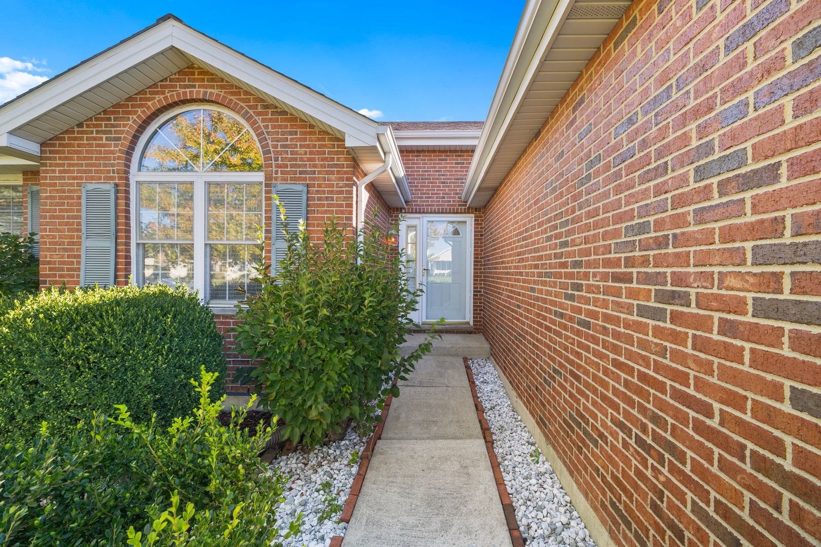 3207 Sandy Ridge Drive Steger, IL 60475 - Photo 2 of 20 a view of a brick house with many windows