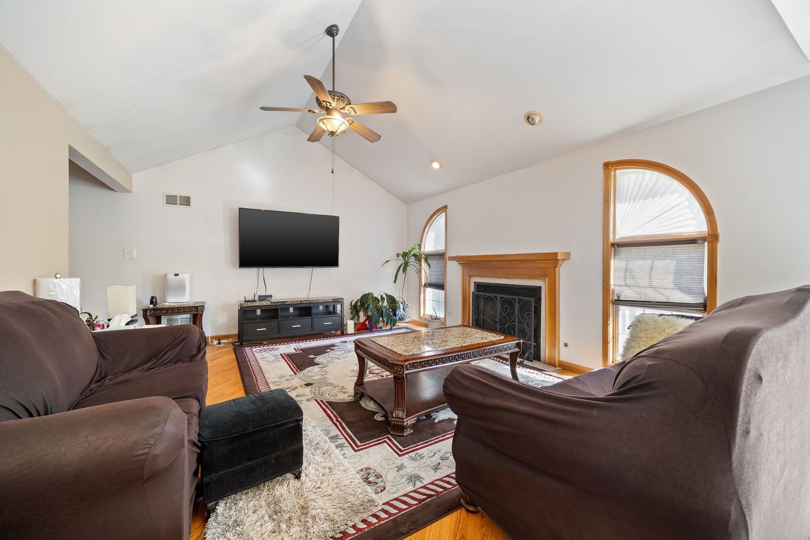 3207 Sandy Ridge Drive Steger, IL 60475 - Photo 4 of 20 a living room with furniture a fireplace and a flat screen tv