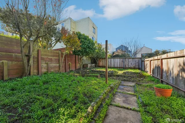 a view of a chair and tables in the patio