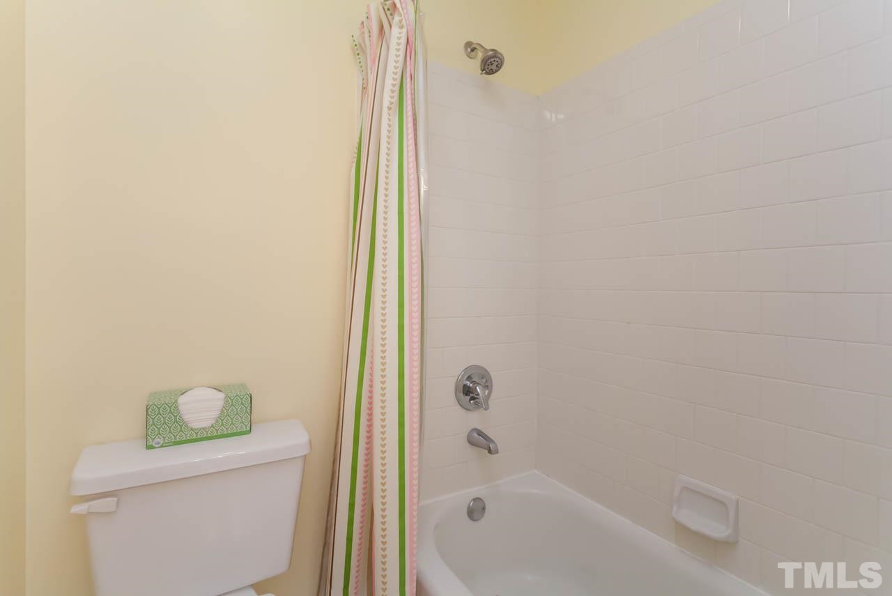 6708 Twin Tree Court Raleigh, NC 27613 - Photo 22 of 25 a bathroom with a bathtub and a toilet