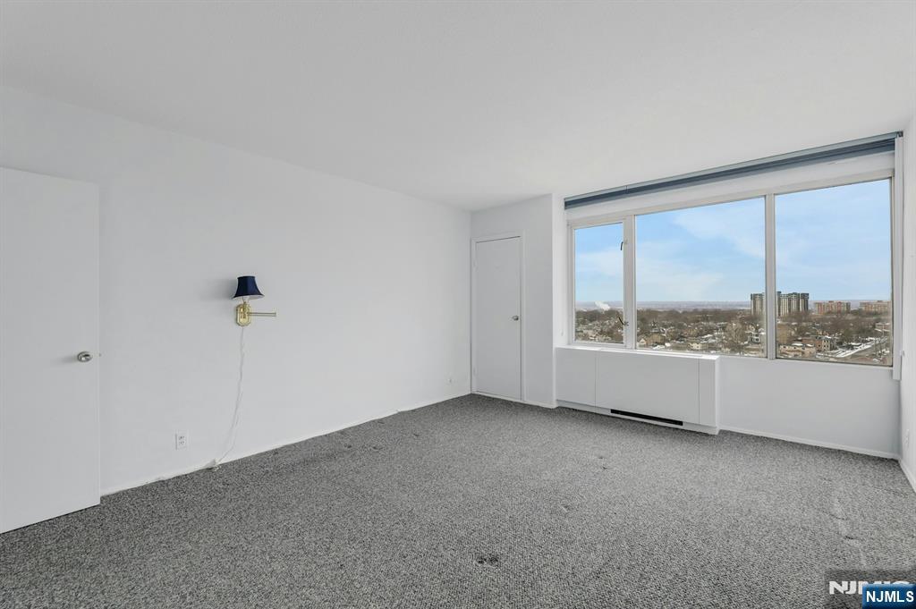 6 Horizon Road, Unit 1508 Fort Lee, NJ 07024 - Photo 31 of 46 an empty room with large windows