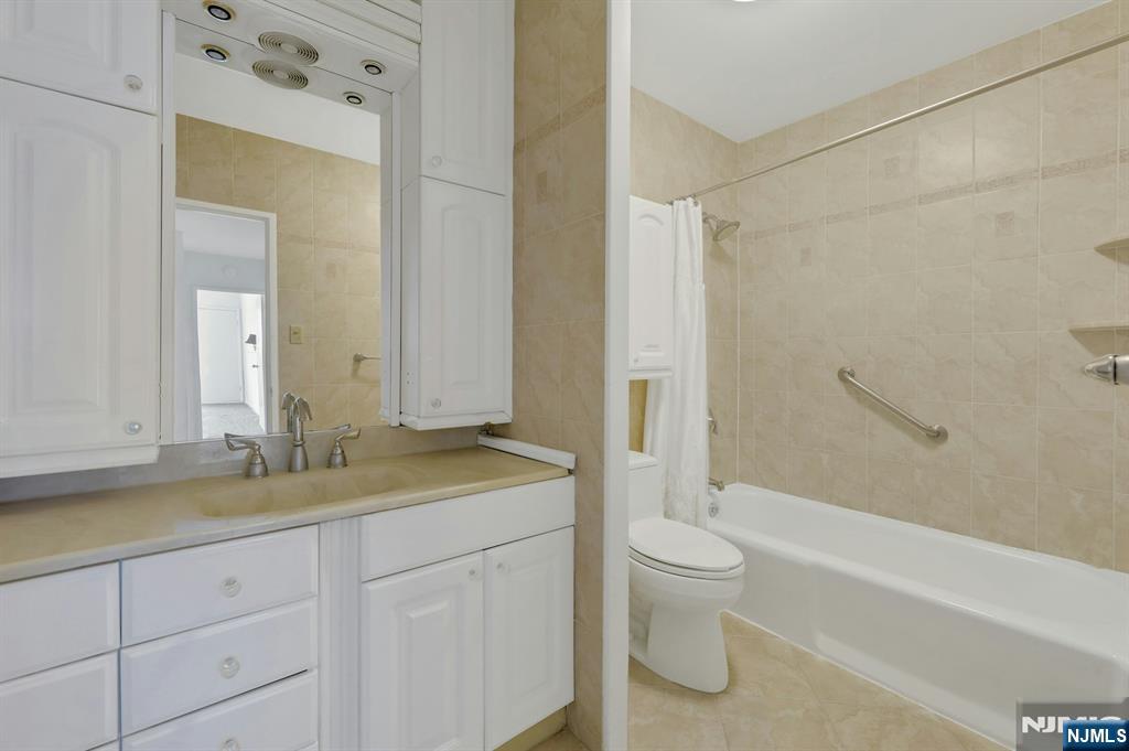 6 Horizon Road, Unit 1508 Fort Lee, NJ 07024 - Photo 34 of 46 a bathroom with a granite countertop sink toilet and shower