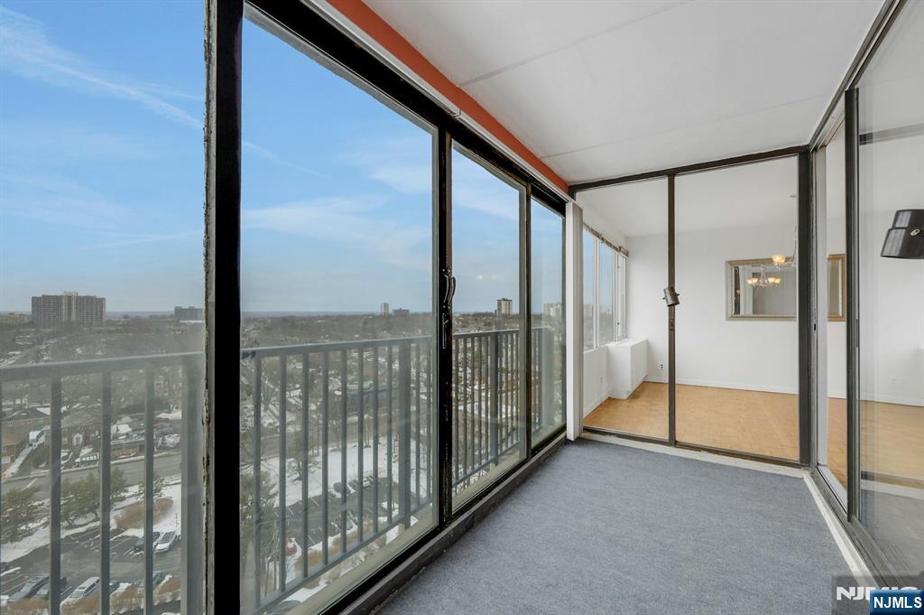6 Horizon Road, Unit 1508 Fort Lee, NJ 07024 - Photo 6 of 46 a view of a glass door and an empty room