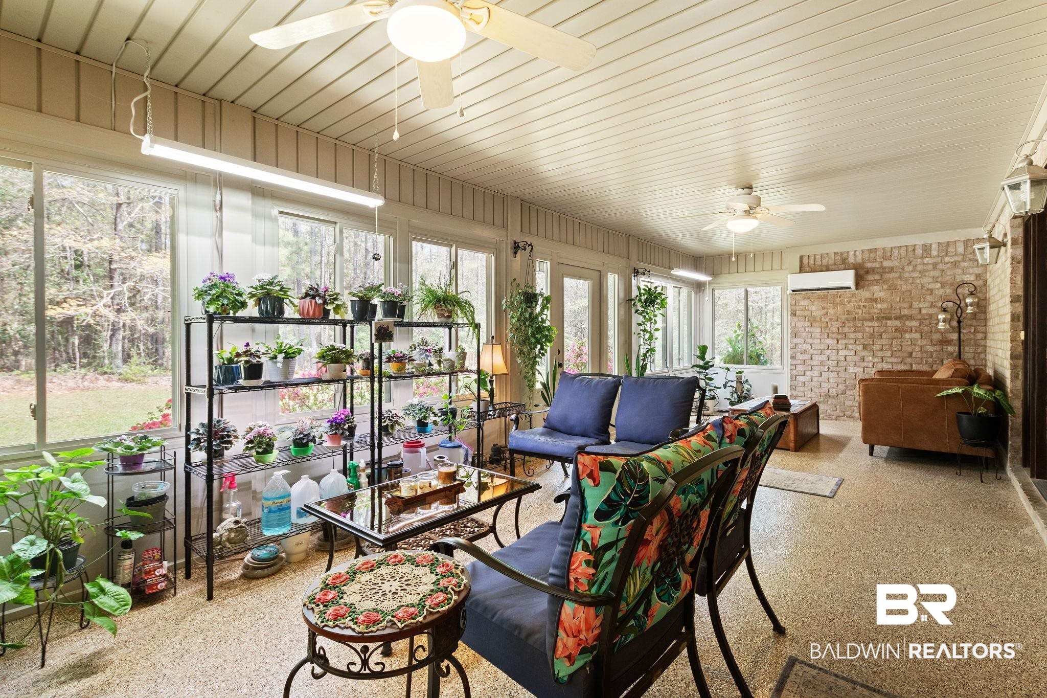 24250 Hack Road Bay Minette, AL 36507 - Photo 5 of 88 Sunroom / solarium featuring speckled floor and a wall mounted mini split
