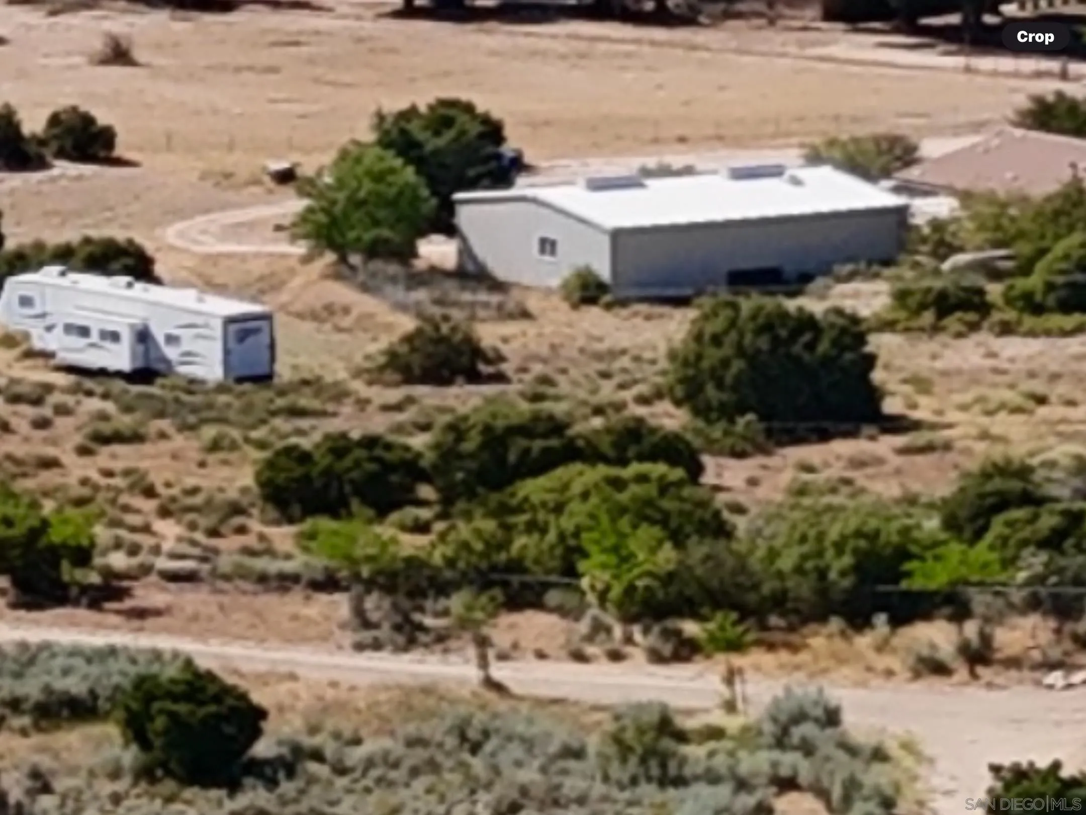 2782 Ribbonwood Road Boulevard, CA 91905 - Photo 24 of 24 a view of a house with a yard and snow