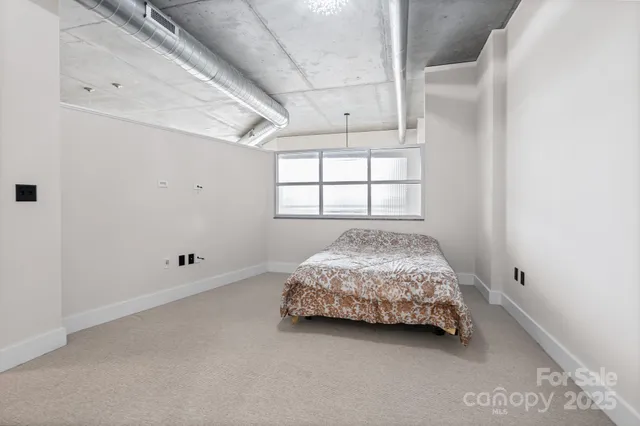 a room with a bed and a window