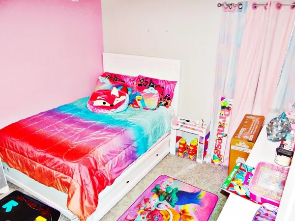 a bedroom with a bed and a bed