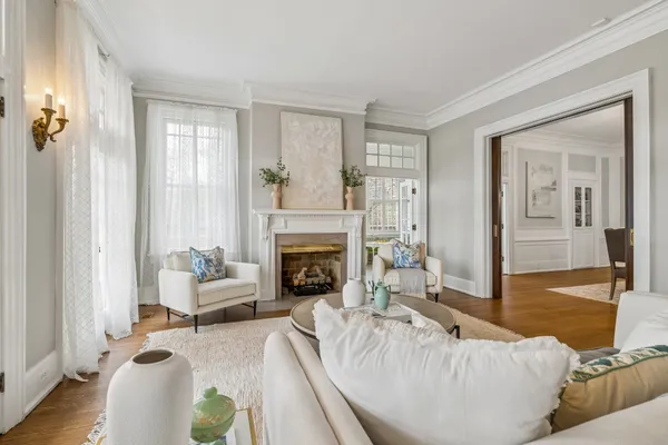 a table and chairs in a room with window